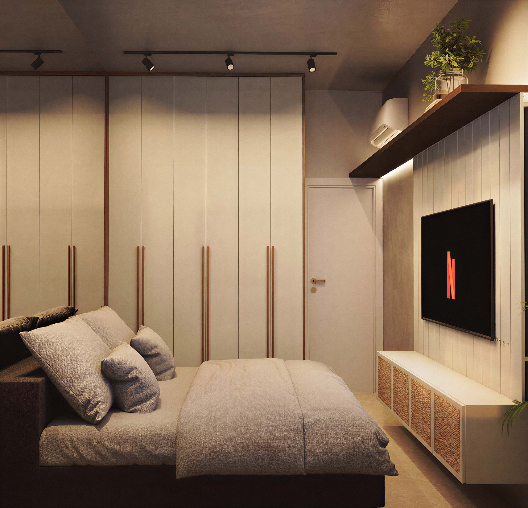 Quarto do apartamento com armário planejado e painel de televisão