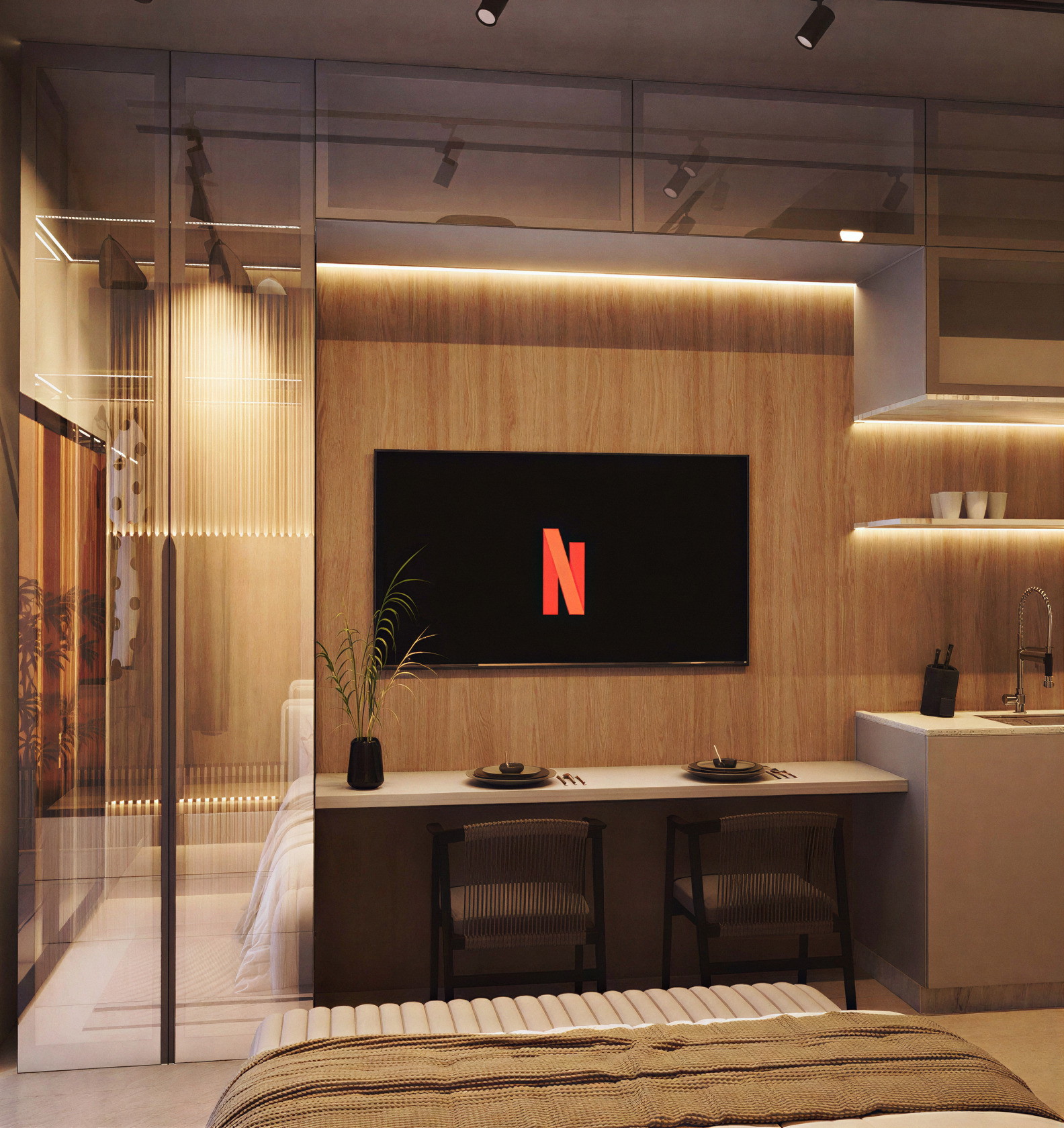 Studio com bancada de trabalho e painel de televisão